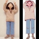 A cartoon and a hand made doll looking the same